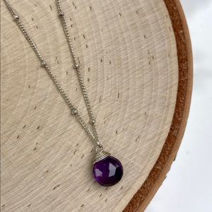 Sterling silver satellite chain with wrapped amethyst teardrop. Spring ring.